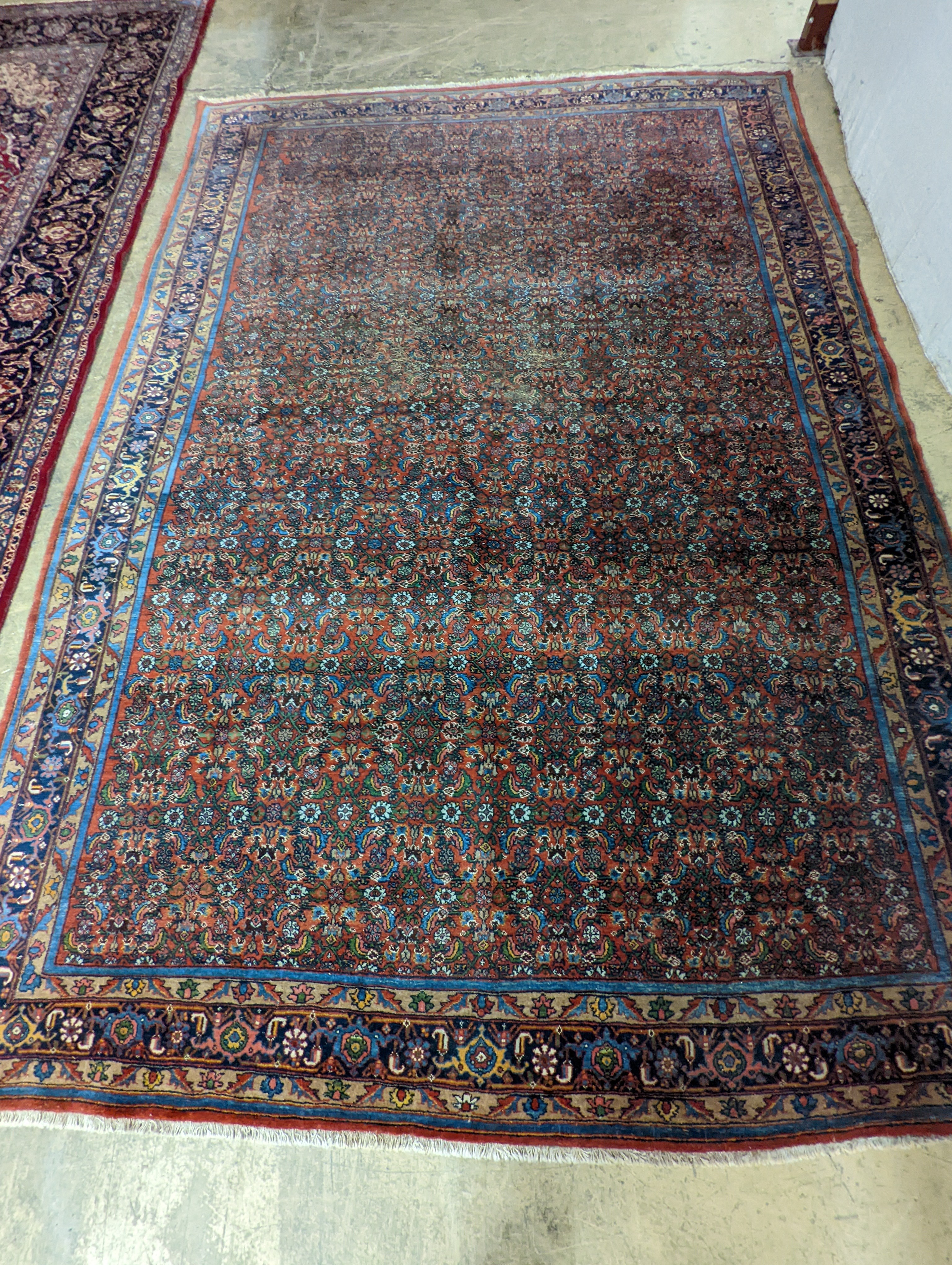 A North West Persian red ground carpet, 360 x 250cm